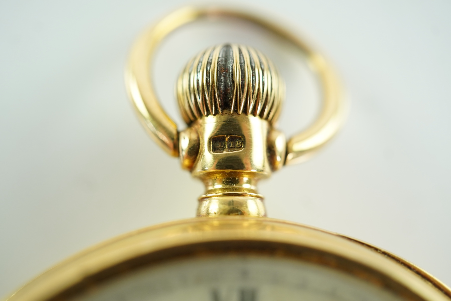 A late Victorian engine turned 18ct gold open faced keyless pocket watch by The American Waltham Watch Company